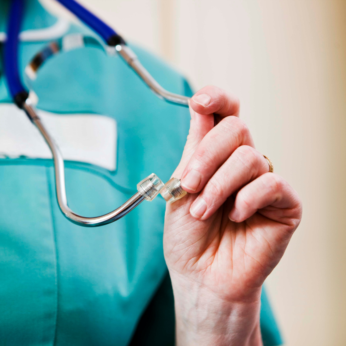 A nurse holding a stethoscope to illustrate the key differences between assisted living and nursing