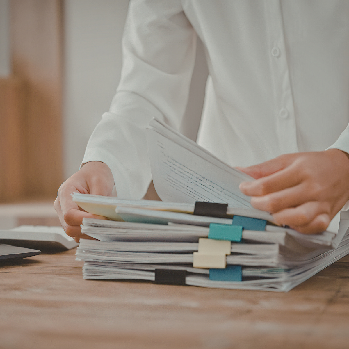 Colorado attorney reviewing underinsured motorist insurance claim documents after a car accident